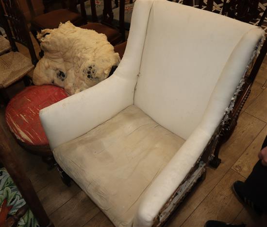 A George III armchair and a Victorian salon chair